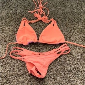 Coral and purple reversible top bikini.